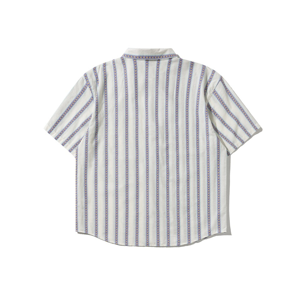 Back view of white short-sleeve shirt with vertical purple and blue patterned stripes, flat lay