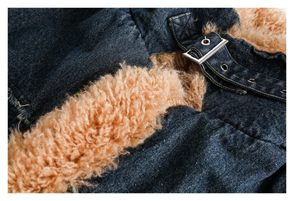 Close-up of tan fuzzy jacket lining beside dark denim and a metal buckle strap with eyelets.