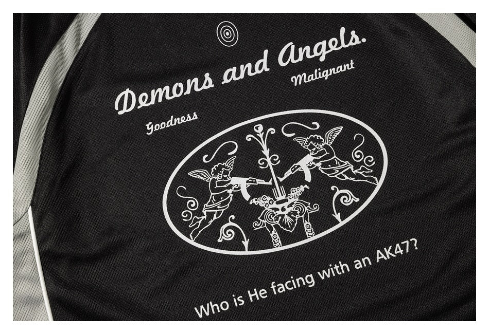 Close-up of a black garment with a white angel illustration and English lettering printed on it.