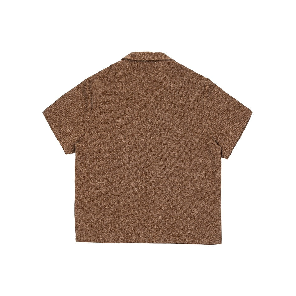 Back view of a brown short-sleeve knit shirt with a notched collar.