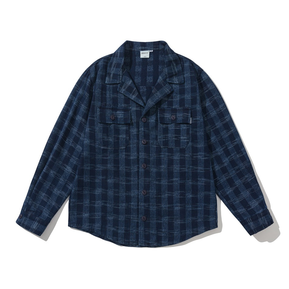Blue plaid long-sleeve shirt jacket with notched collar, button front and two flap chest pockets, flat lay front view