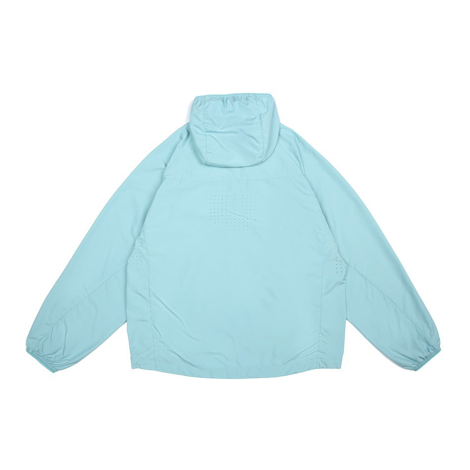 Back view of a light aqua hooded jacket laid flat, with long sleeves, elastic cuffs, and perforated ventilation panels.