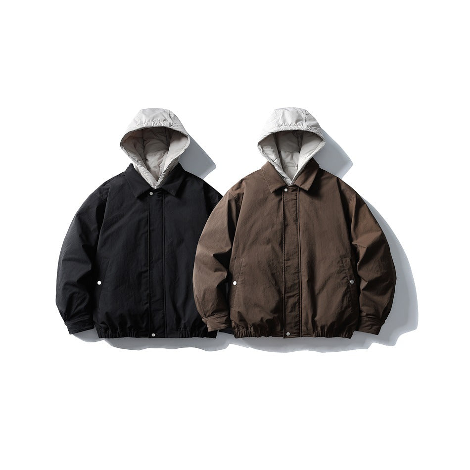 Two hooded jackets shown from the front: one black and one dark brown, both with light gray hoods.