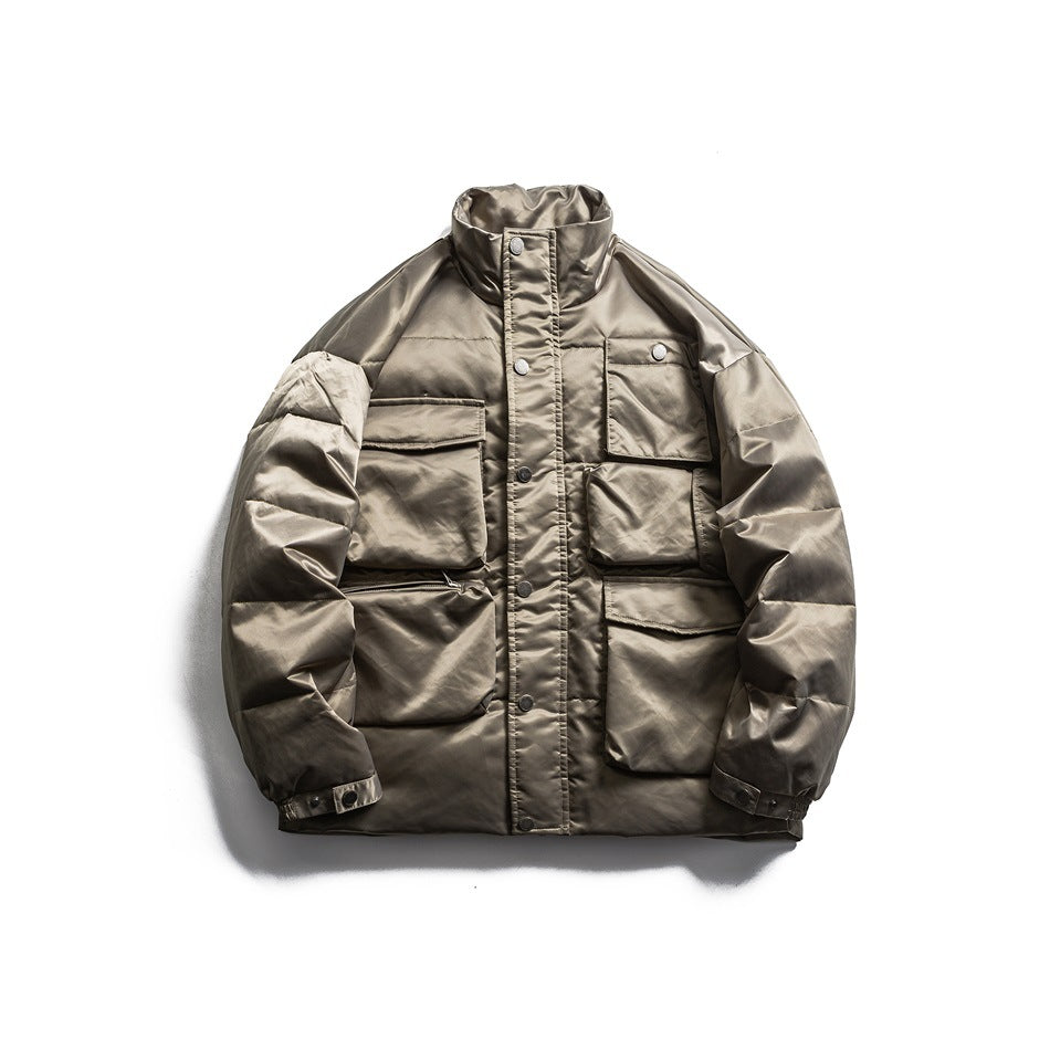 Gray green quilted stand-collar puffer jacket with snap front and multiple flap pockets, flat lay front view