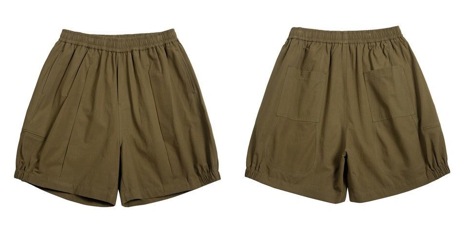 Olive-brown loose shorts shown from front and back, with an elastic waist and two rear patch pockets.