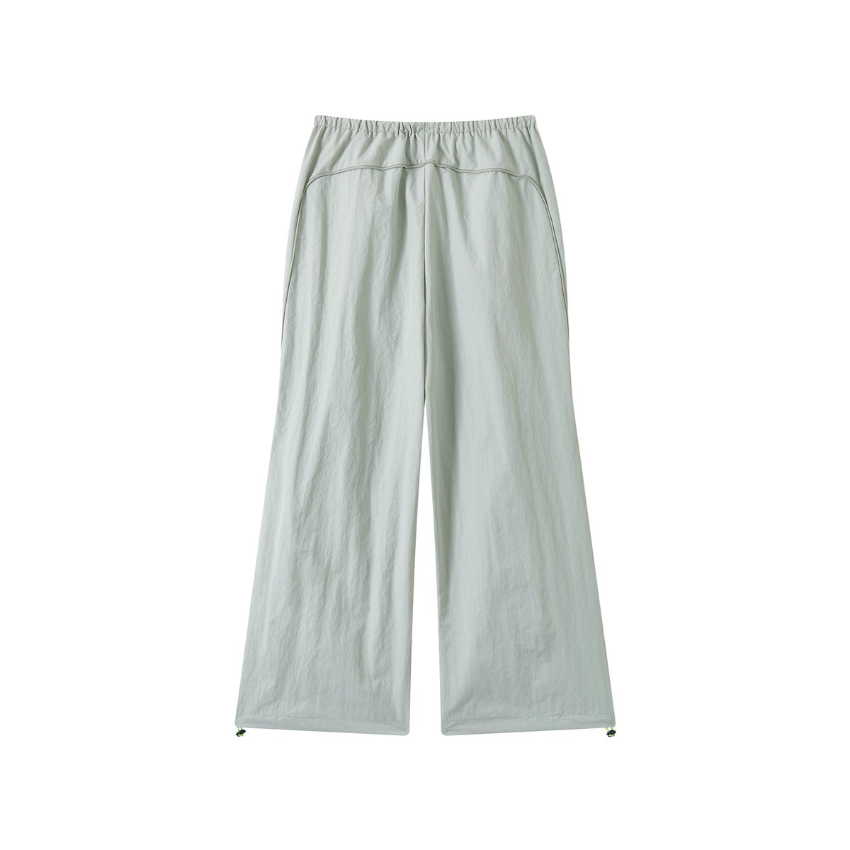 Back view of pale sage wide-leg pants with an elastic waist and curved yoke seam.