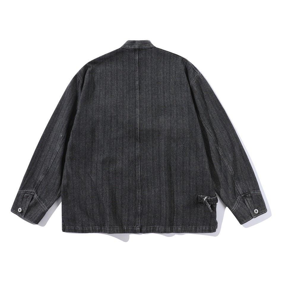 Back view of black washed denim kimono-style jacket with center seam, buttoned cuffs and side buckle tab