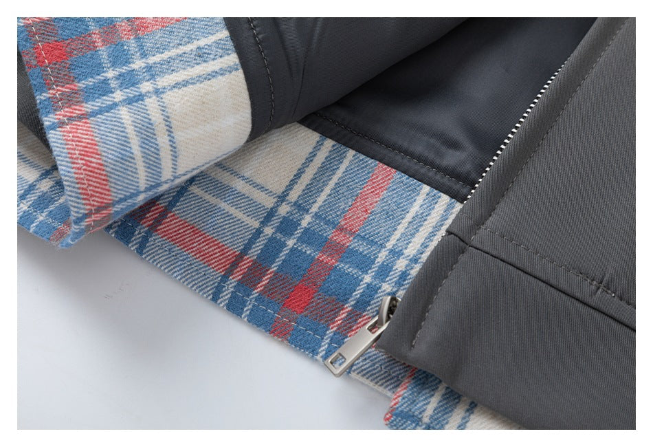 Close-up of the jacket opening, showing blue, red, and cream plaid lining and a zipper.