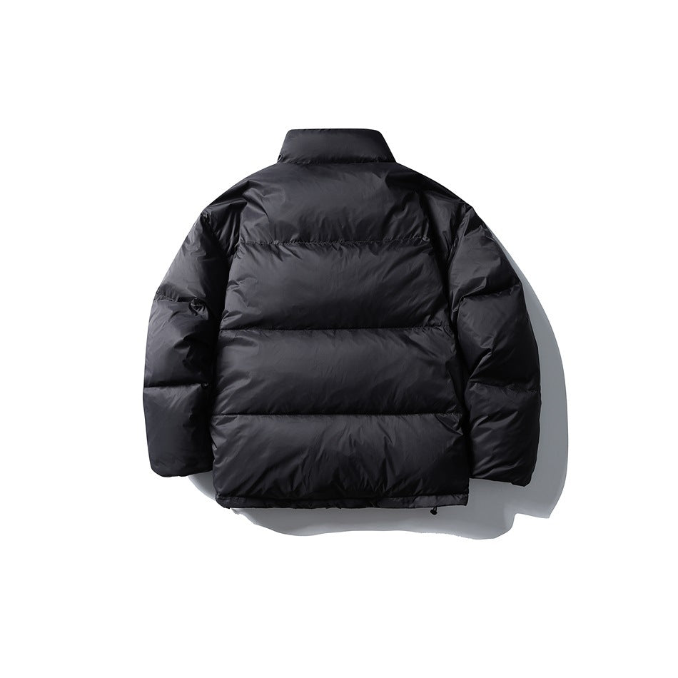 Black quilted puffer jacket back view with horizontal baffles and stand collar, flat lay
