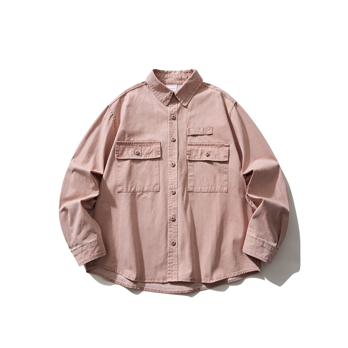Pink long-sleeve button-front shirt with two flap chest pockets and curved hem, flat lay front view
