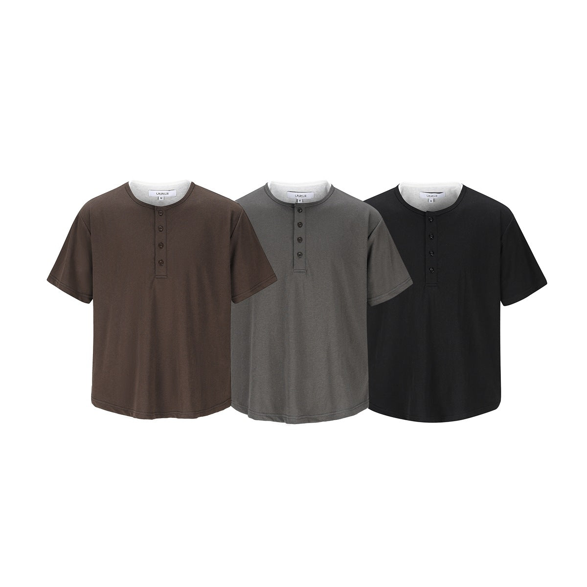 Three short-sleeve crew-neck shirts with button plackets shown in brown, gray, and black.