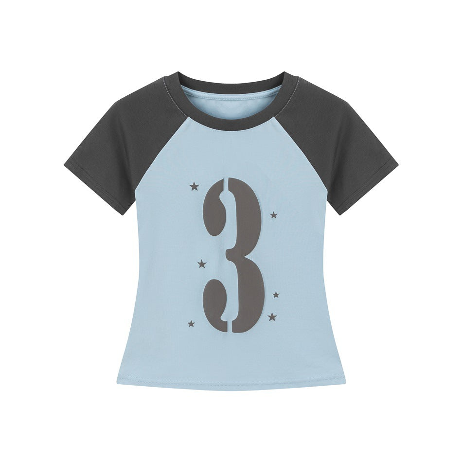 Light blue raglan T-shirt with dark gray sleeves and collar, large stencil number 3 graphic and stars, flat lay