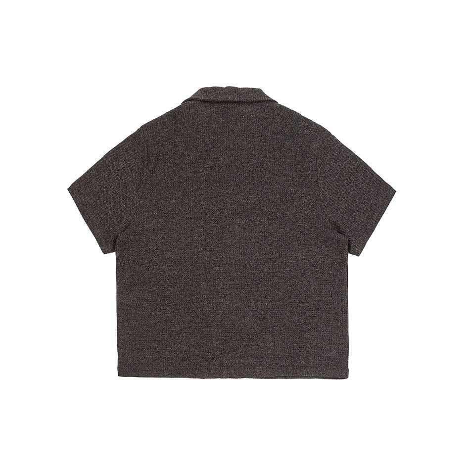 Back view of dark heathered gray-brown short-sleeve camp collar shirt, flat lay