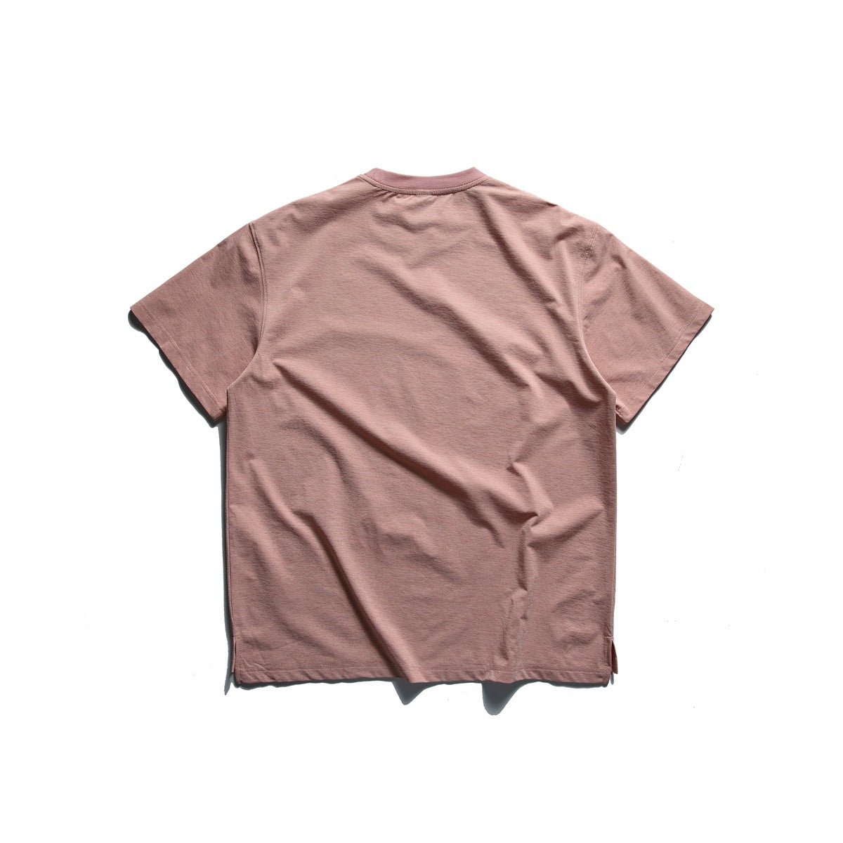 Back view of a plain dusty rose short-sleeve crew-neck T-shirt laid flat on a white background.