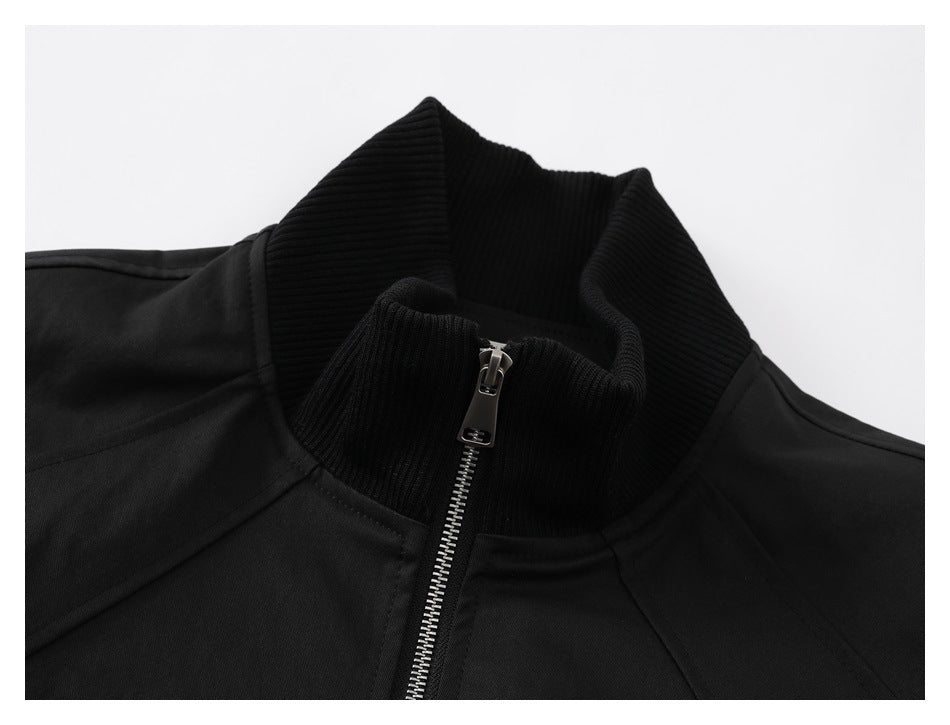 Close-up of the jacket's black ribbed collar and silver front zipper.