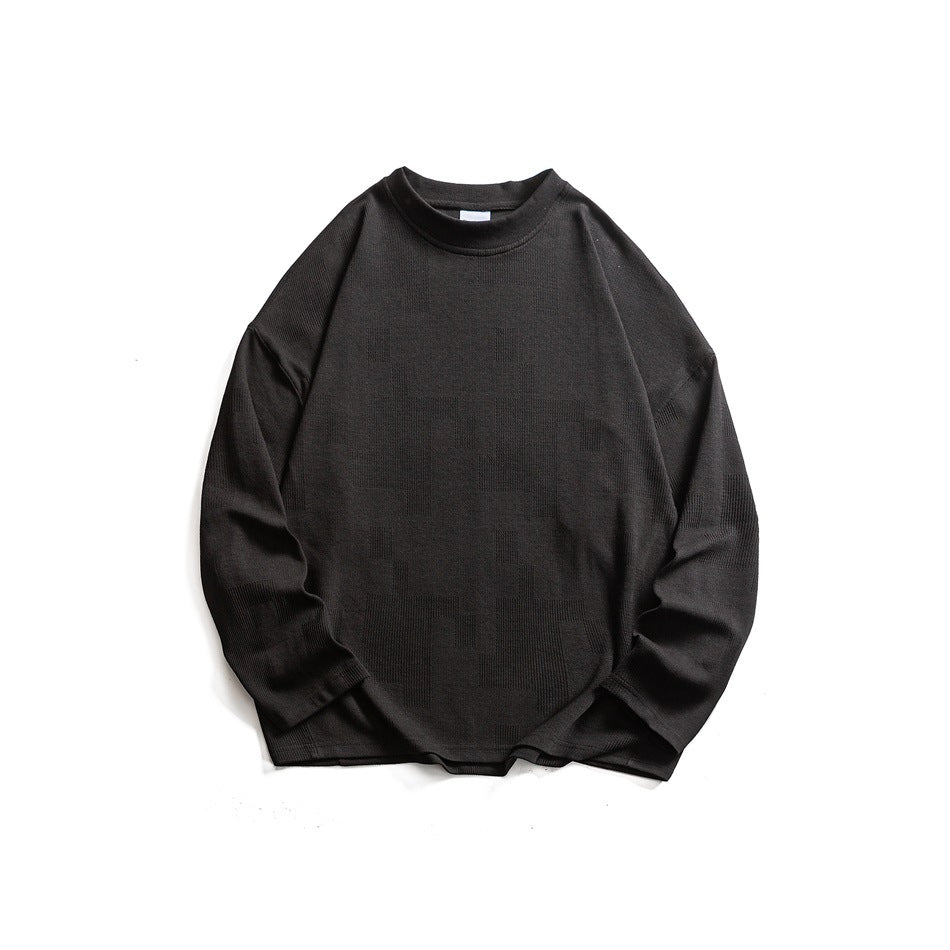 Black long-sleeve crew-neck sweatshirt flat lay with drop shoulders and subtle textured pattern