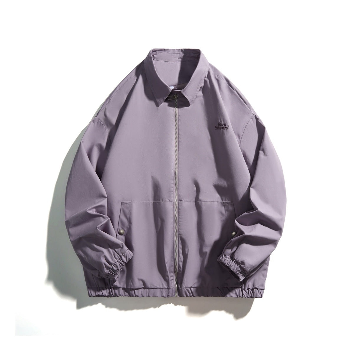 Purple zip-front jacket with pointed collar, elastic cuffs and hem, front pockets with side snaps and chest embroidery