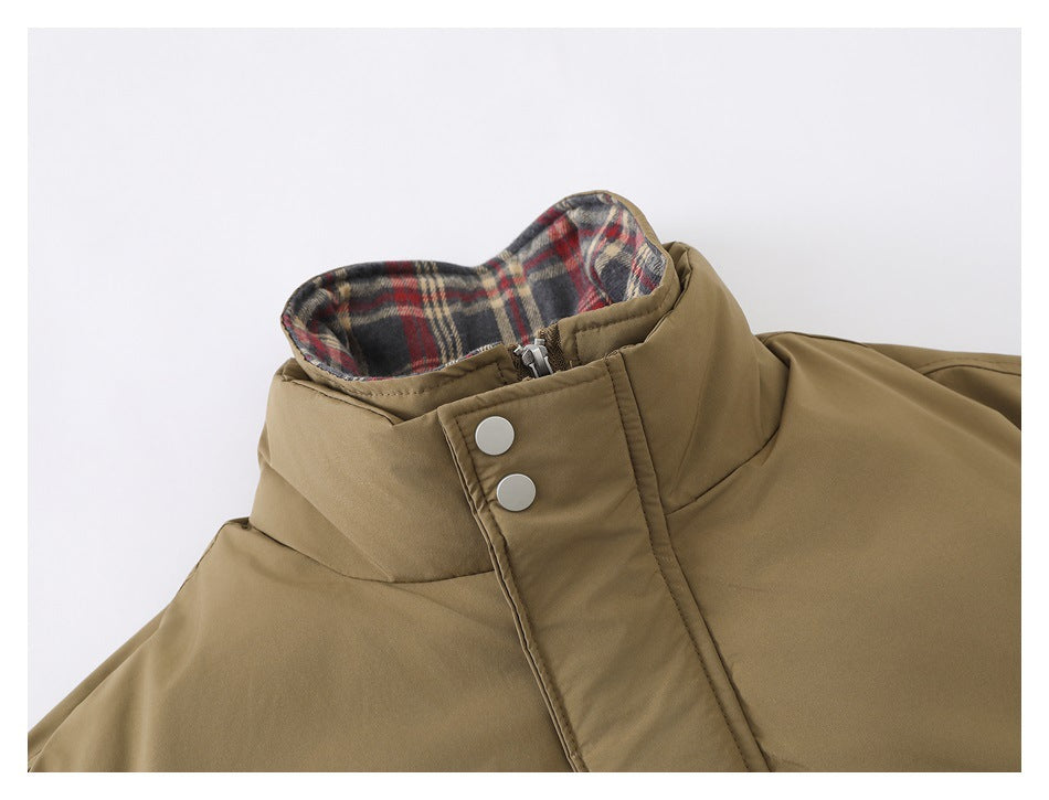 Close-up of the khaki jacket's stand collar, plaid lining, zipper and snap-button flap.