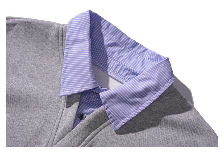 Close-up of the lavender striped collar and button placket on a gray top.