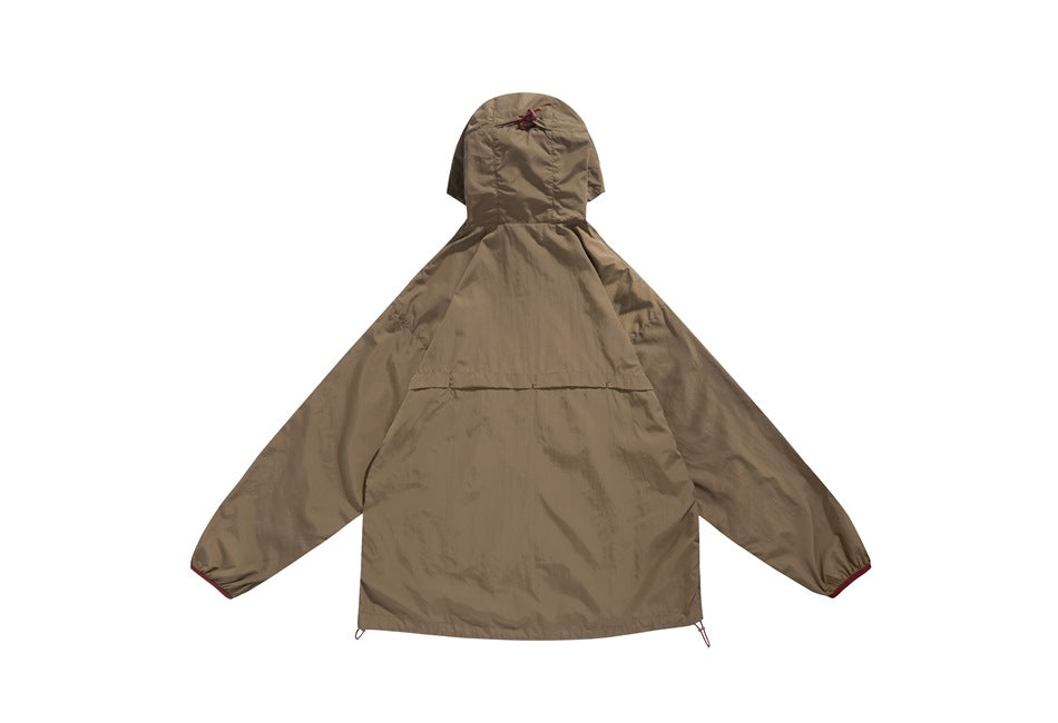 Back view of a taupe hooded jacket laid flat on white, with a small hood emblem and dark red sleeve accents.