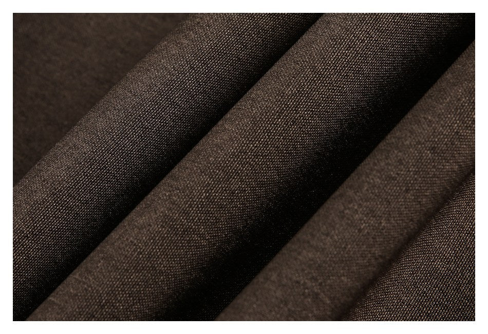 Macro close-up of dark brown woven fabric arranged in soft folds.