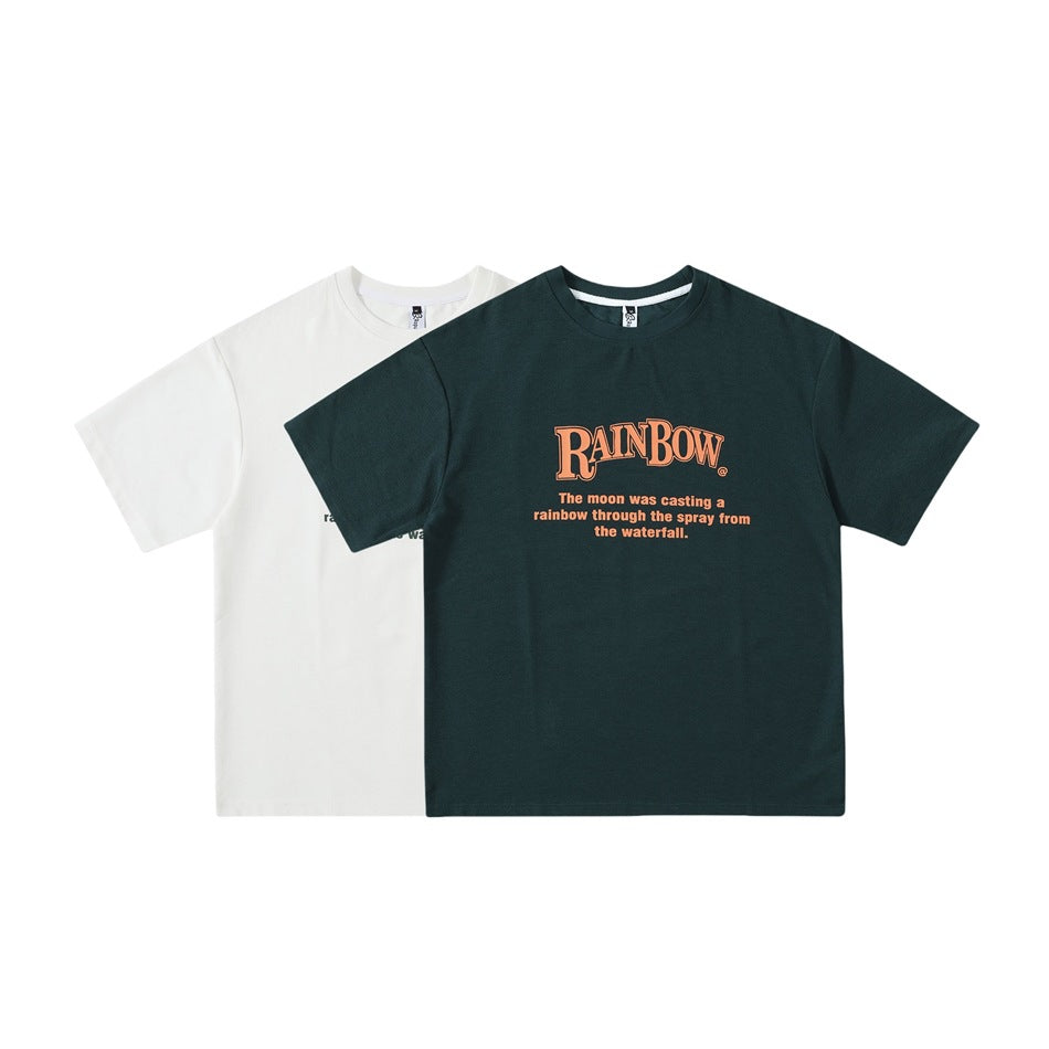 Front view of two short-sleeve crew-neck T-shirts, one off-white and one dark green, with chest lettering.