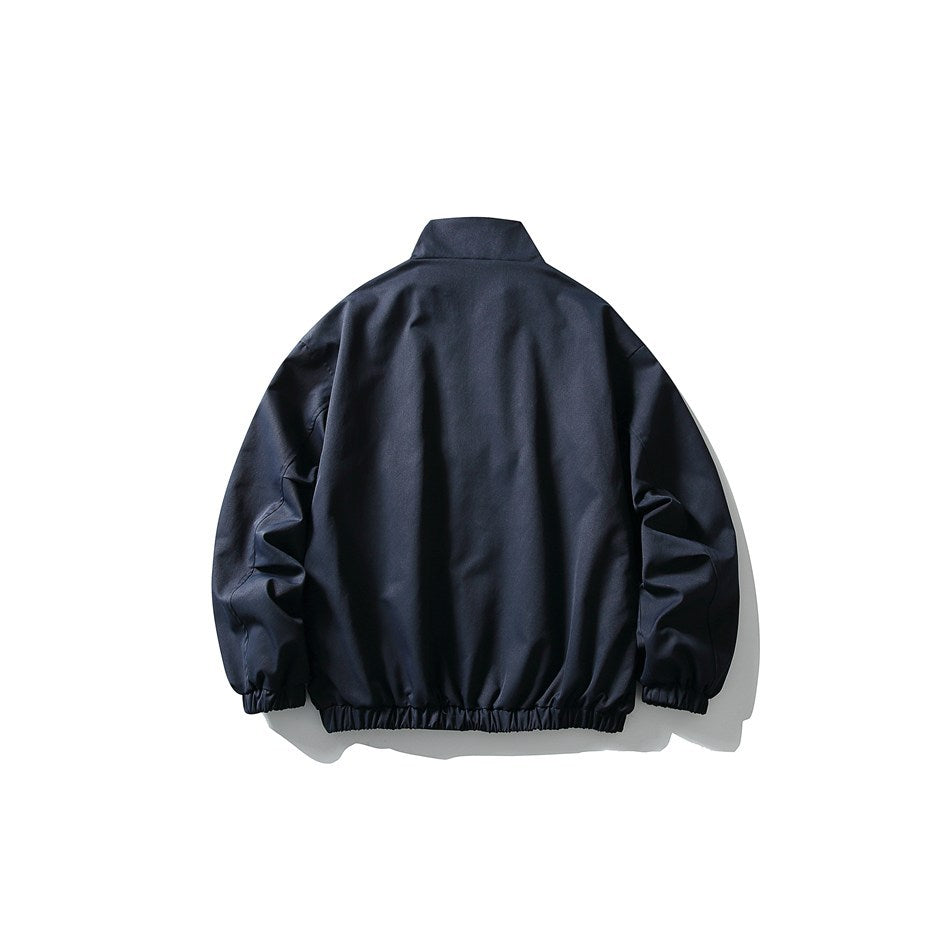 Back view of a navy blue stand-collar jacket with elastic cuffs and hem, laid flat