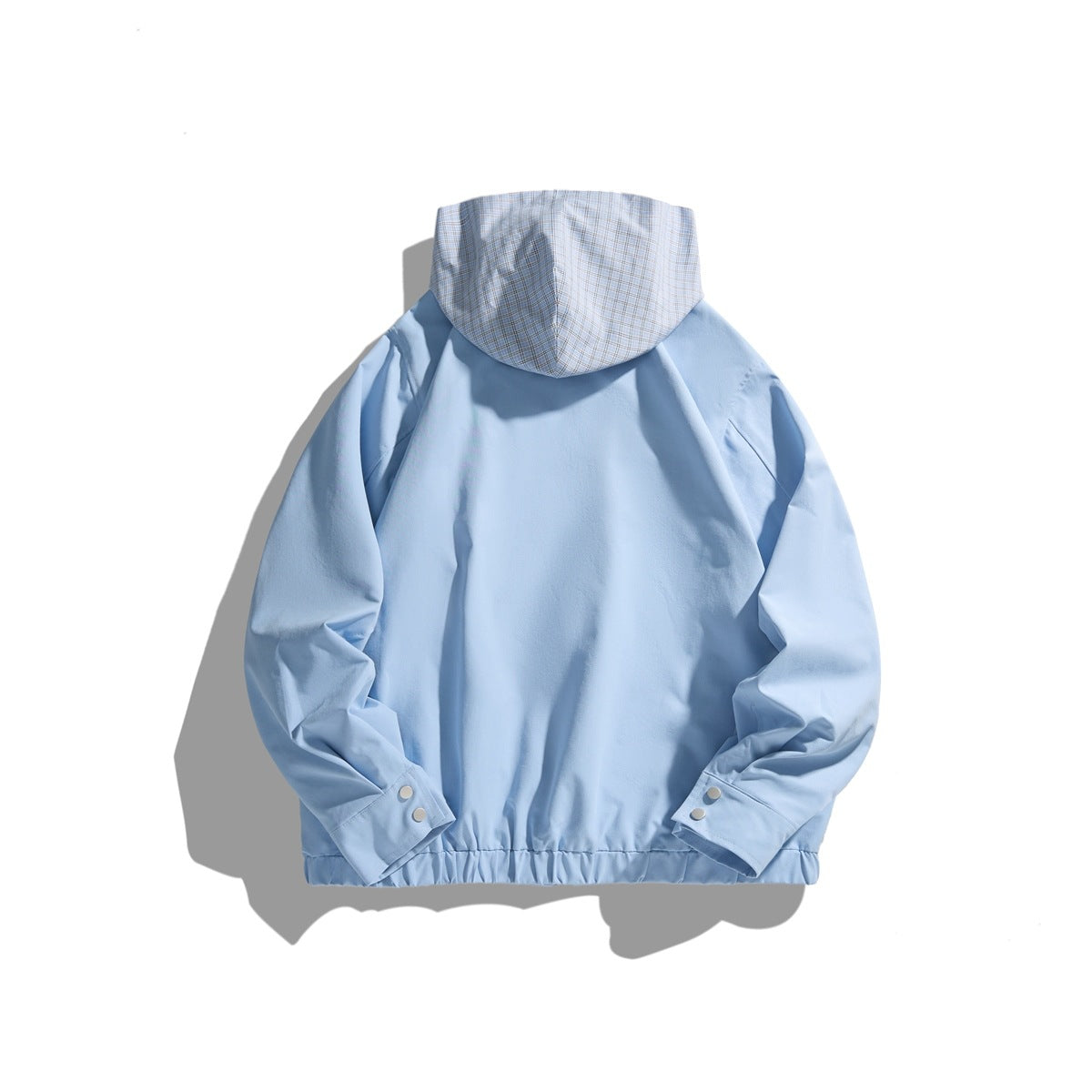 Back view of sky blue jacket with plaid hood, raglan sleeves, snap cuffs and elastic hem