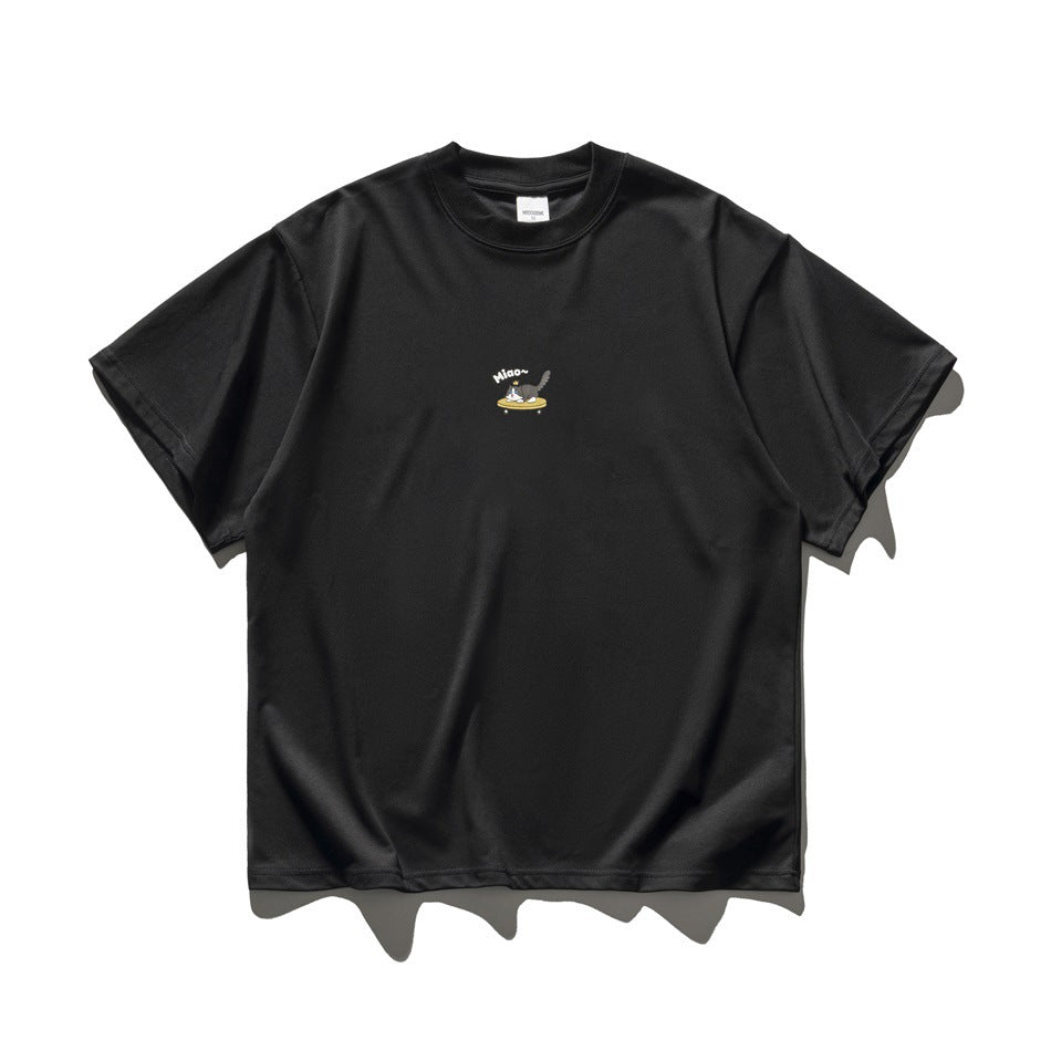 Black short-sleeve crew-neck T-shirt flat lay with a small cat-on-skateboard chest print