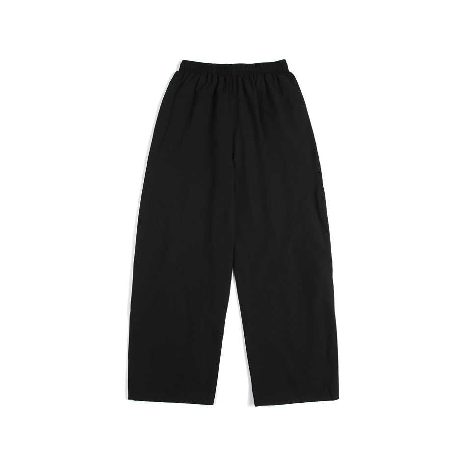 Black loose straight-leg pants with an elastic waistband, shown against a white background.