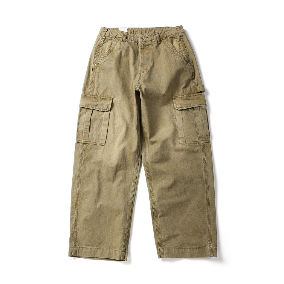 Front flat lay of washed khaki wide-leg cargo pants with large flap side pockets and a button zip fly