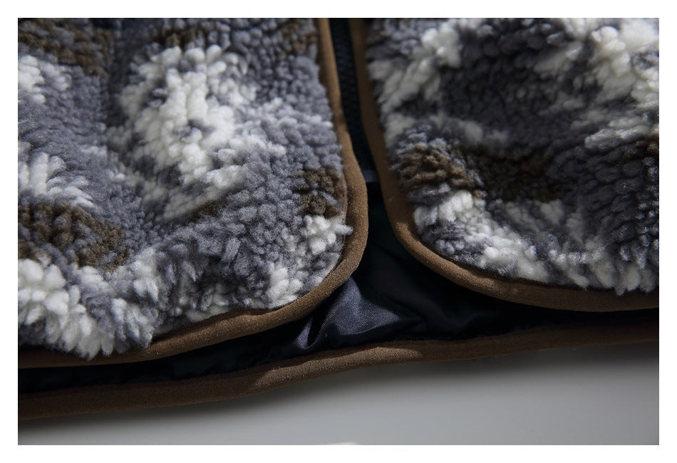 Close-up of the fleece jacket's brown-bound lower hem, front edges, and dark lining.