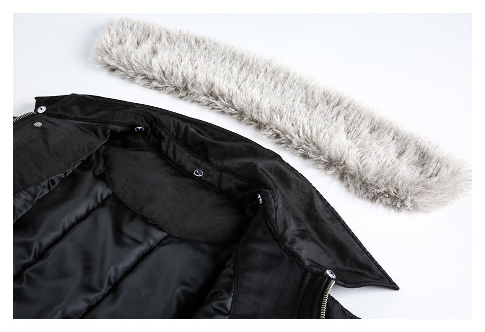 Detachable-looking gray faux-fur trim beside the open upper section of a black coat.