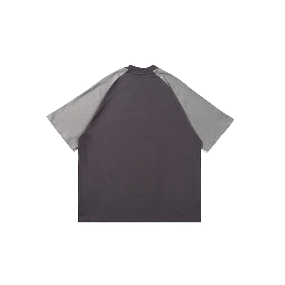 Back of a flat-lay raglan T-shirt with a dark charcoal body and gray short sleeves.