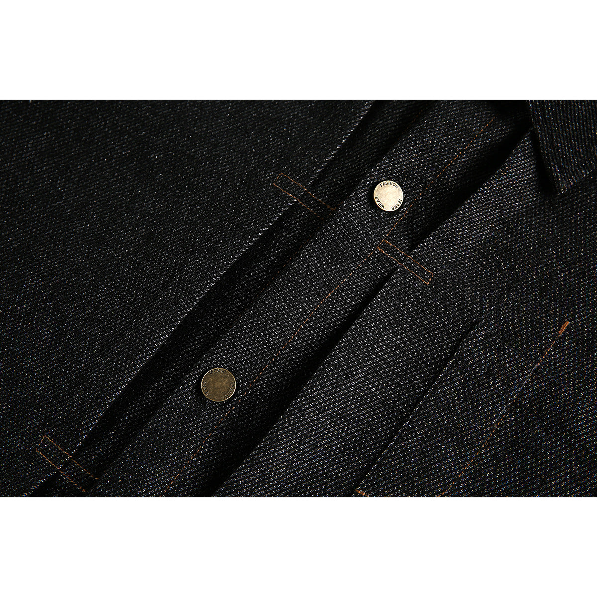 Close-up of black jacket front placket with brass-tone buttons and orange contrast stitching.