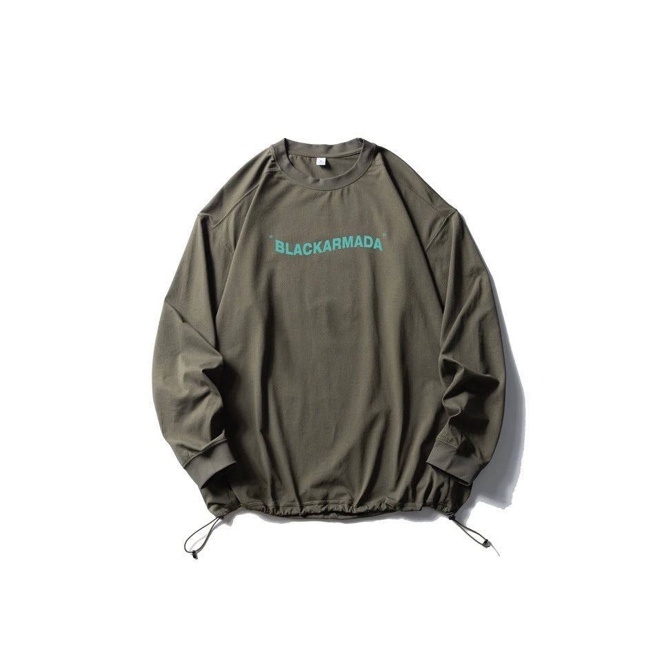 Army green long-sleeve crew-neck top with teal chest text print and drawstring hem, flat lay