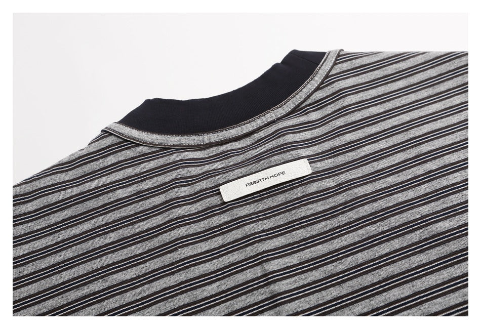 Close-up of the striped T-shirt's back neckline and a small sewn-in label.