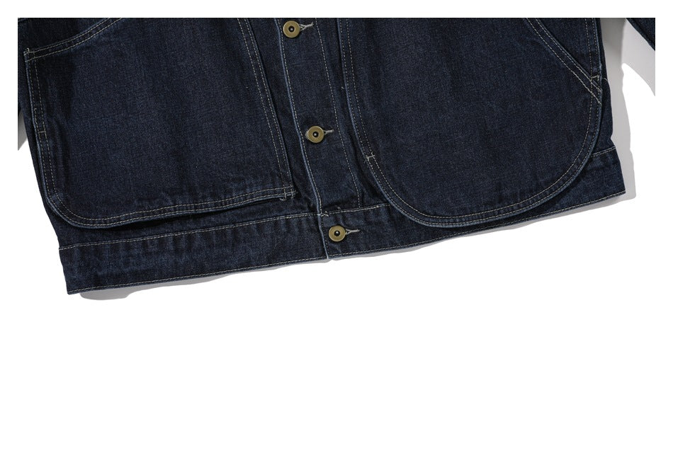 Close-up of the jacket's lower front, showing two large patch pockets, the buttoned placket, and hem.