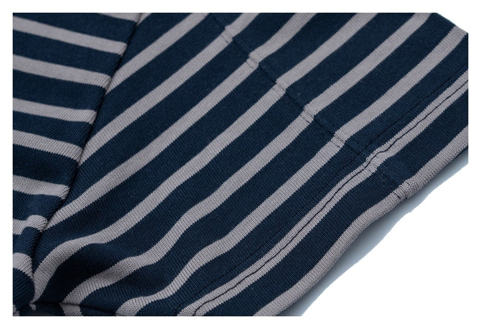 Close-up of the striped T-shirt's finished lower hem and stitching.