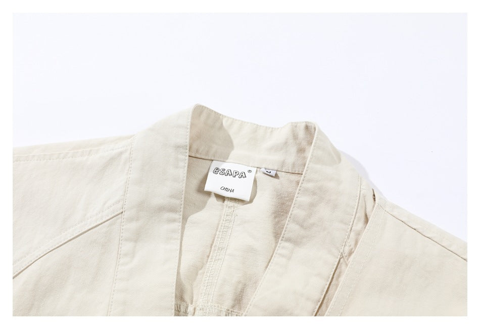 Close-up of the off-white jacket collar and sewn neck label marked BSAPA, CHINA, and M.