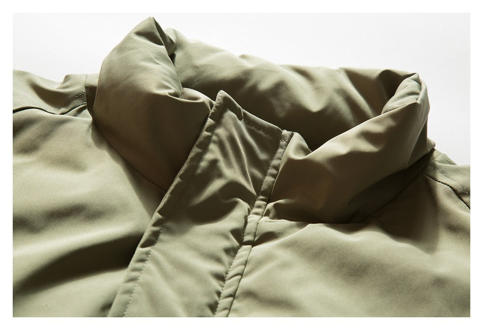 Close-up of an olive khaki jacket's tall collar and front placket.