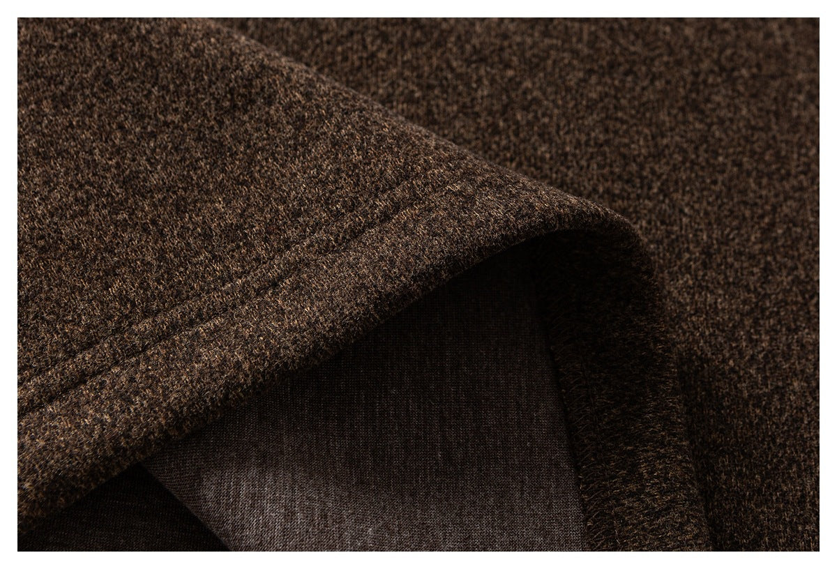 Close-up of brown garment fabric folded back to reveal its darker inner side.