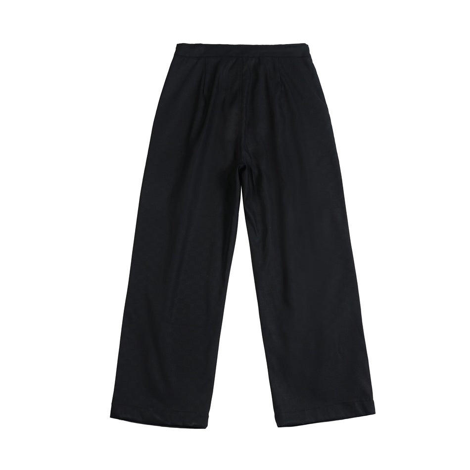 Back view of black wide-leg trousers with a plain waistband and no visible rear pockets.