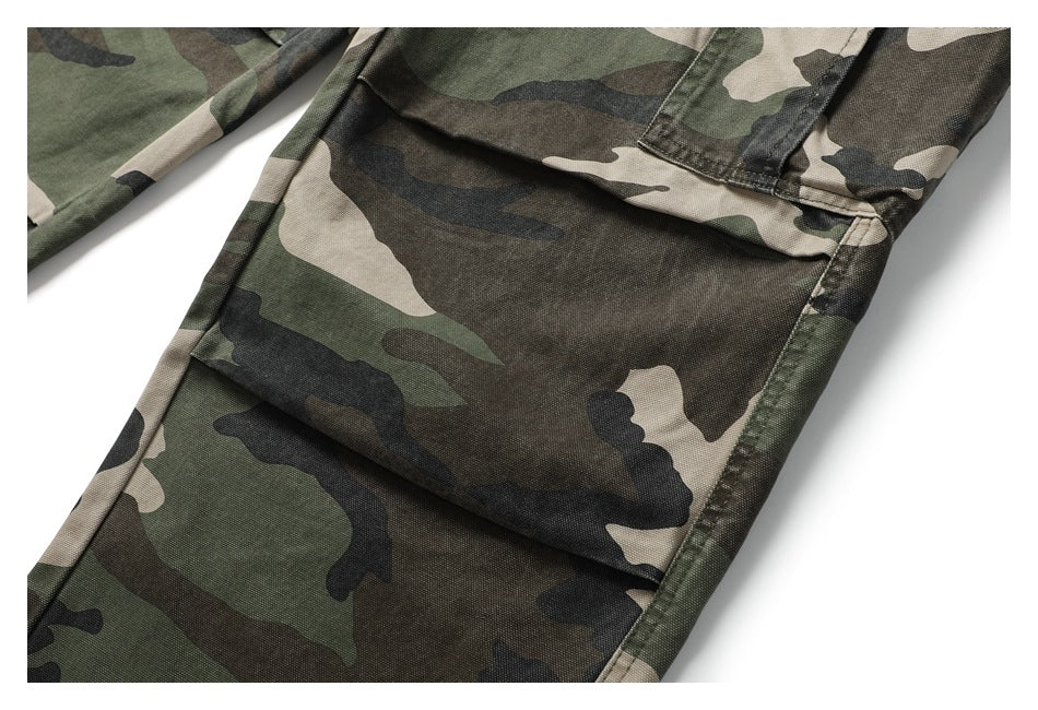 Close-up of the camouflage pants' leg and stitched flap cargo pocket.
