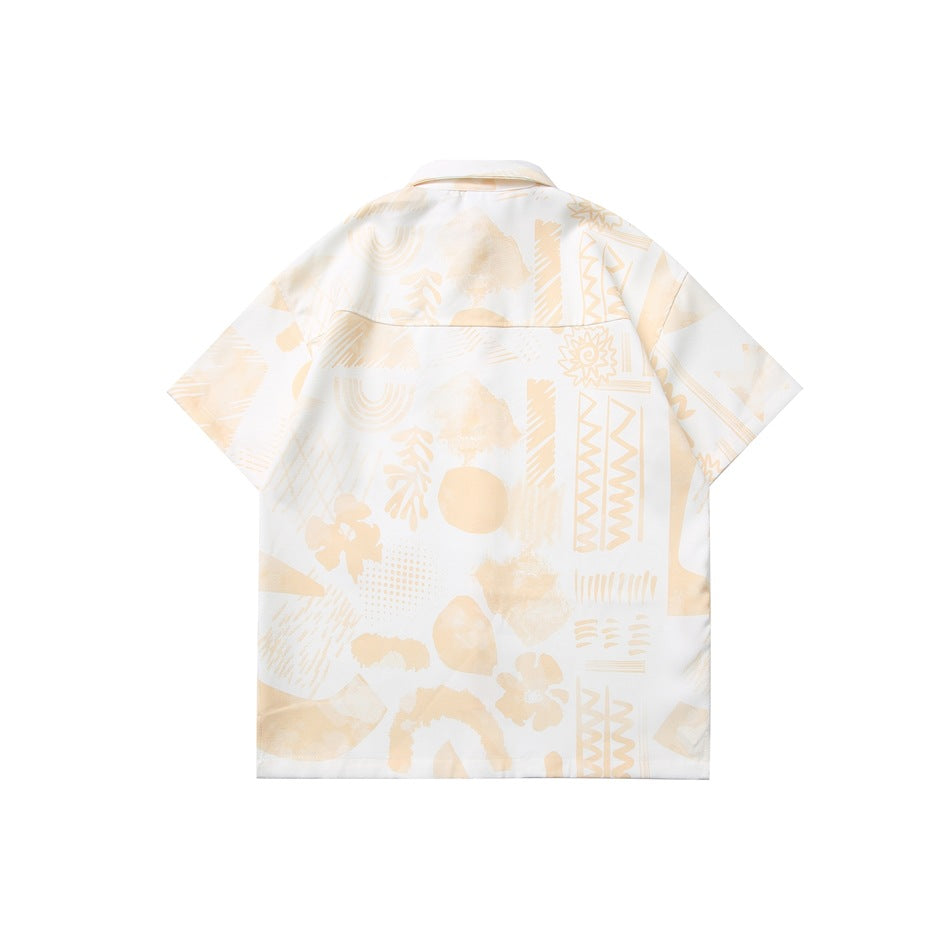 Back view of a short-sleeve white shirt laid flat, covered in a pale beige abstract print.