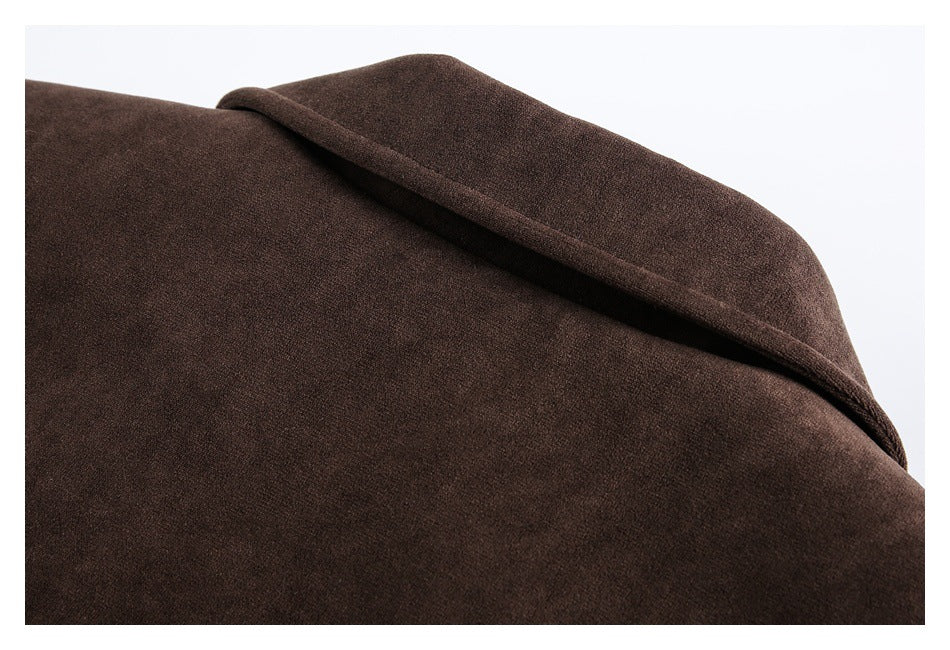 Close-up of a dark brown garment showing a folded collar edge and fine fabric texture.