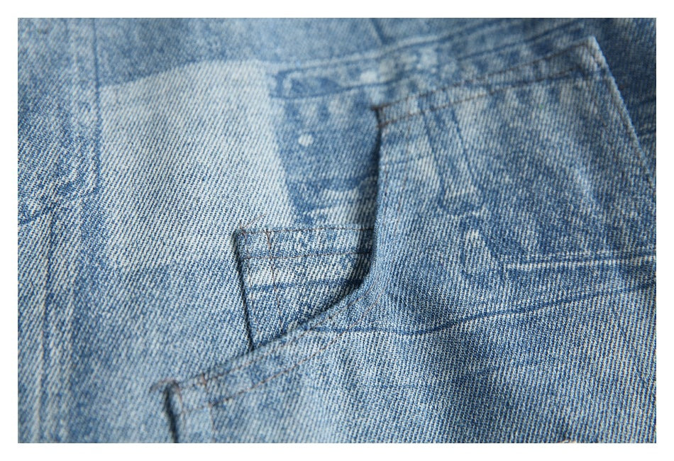 Close-up of a blue printed denim garment showing pocket and panel stitching.