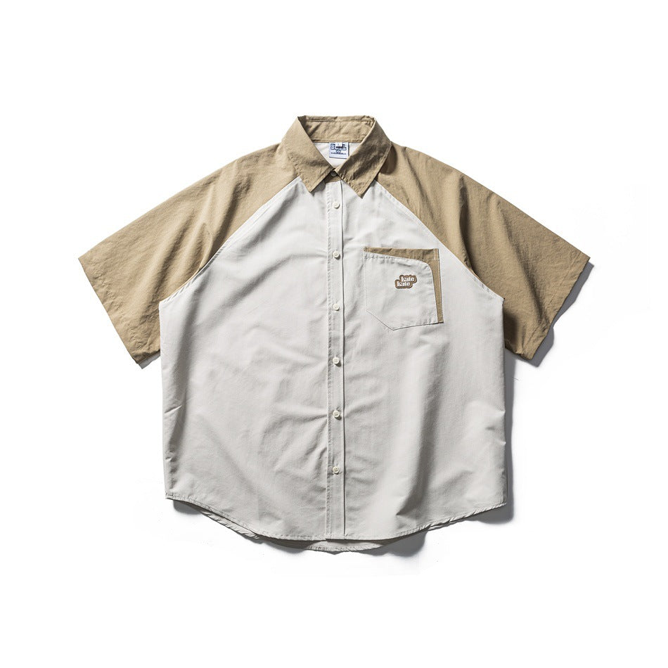 Short-sleeve raglan shirt with khaki sleeves and collar, light gray-beige body, chest pocket and button front, flat lay