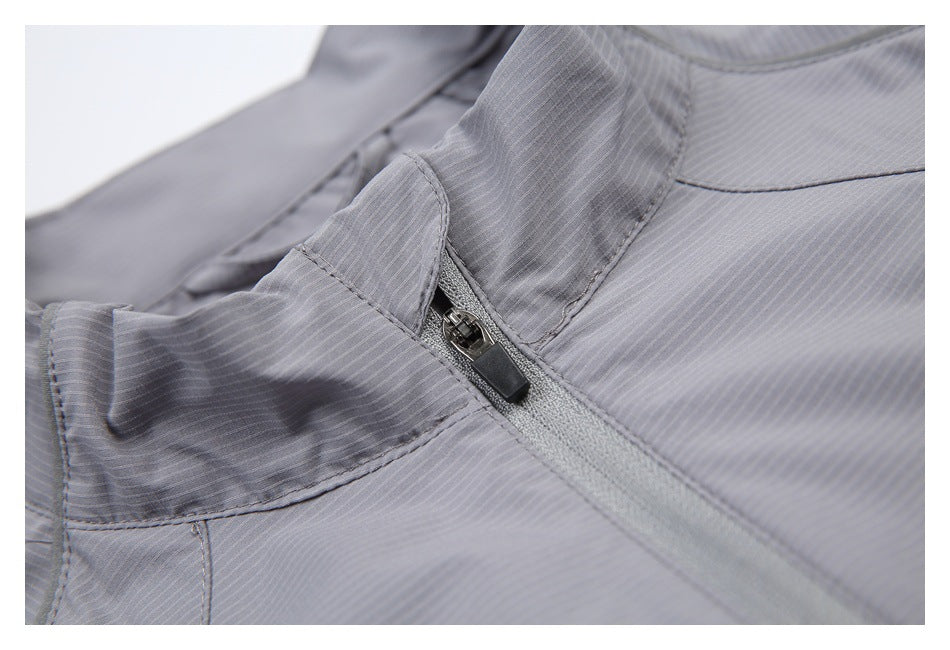 Close-up of the jacket's collar and zipper pull, with fine vertical stripes and visible stitching.