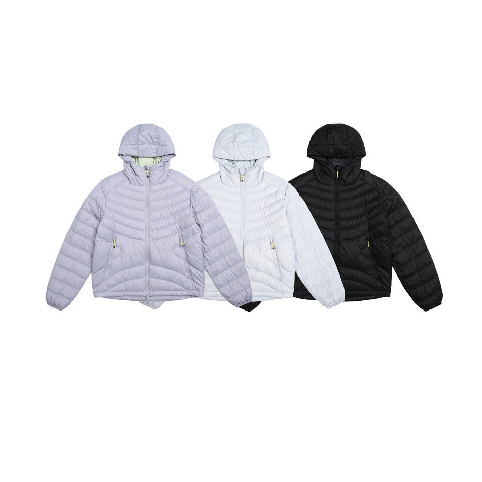 Three hooded quilted jackets shown together in lavender, white, and black.